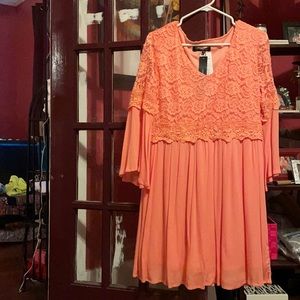 Peach colored knee length flowy dress